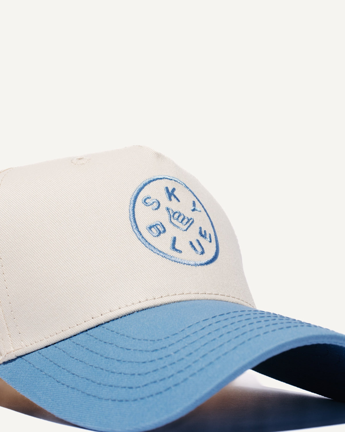 Cream and sky blue Skyblue snapback with shaka badge